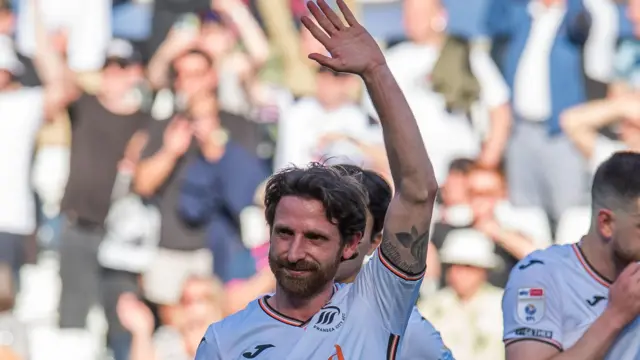 Joe Allen waves to Swansea fans
