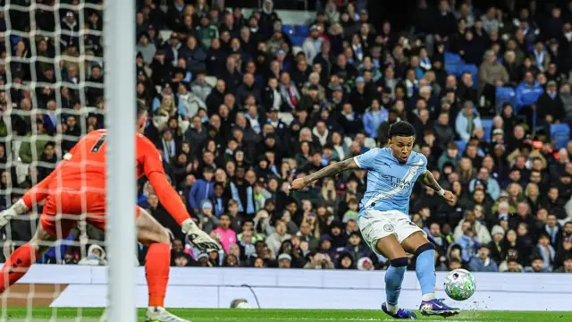 Savinho of Manchester City scores