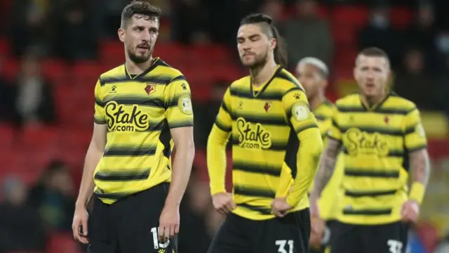 Watford players look dejected