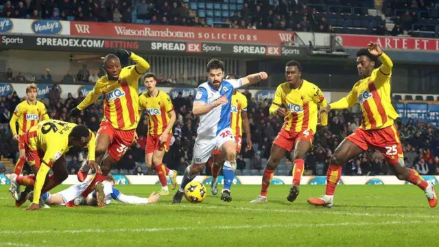 Watford players at Ewood Park against Blackburn Rovers. 