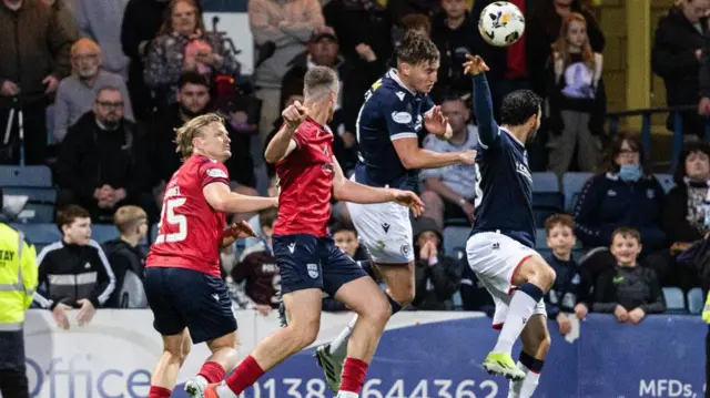 Dundee's Antonio Portales (right) was ruled to have handled