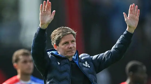 Oliver Glasner waves at the end of time against Bournemouth towards Crystal Palace fans