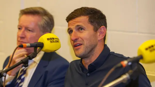 Portsmouth boss John Mousinho speaking at BBC Radio Solent's fan forum in 2024