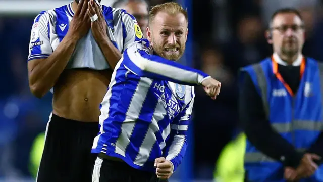 Barry Bannan punches the air during Sheffield Wednesday's dramatic comeback win over Peterborough in the League One play-off semi-final in May 2023