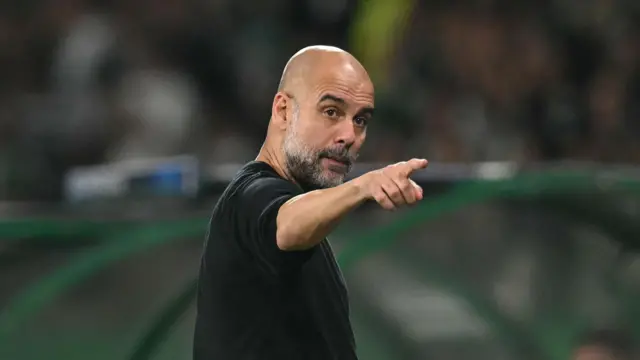 Pep Guardiola points during match