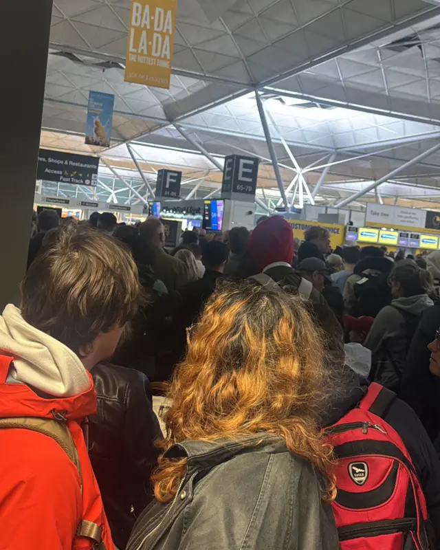 An image of people at a packed airport