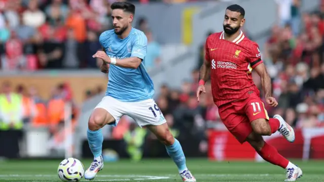 Liverpool's Mohamed Salah chases Nottingham Forest's Alex Moreno in possession