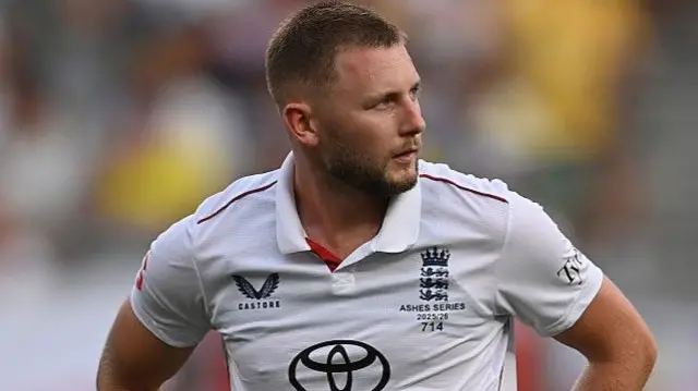 Gus Atkinson looks on