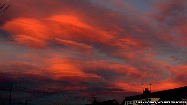 Red sky with lens shaped clouds