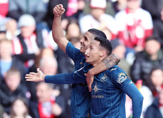 Ronald celebrates at Sunderland alongside Kyle Naughton