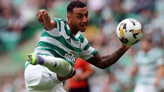 Adam Idah strikes the ball while playing for Celtic