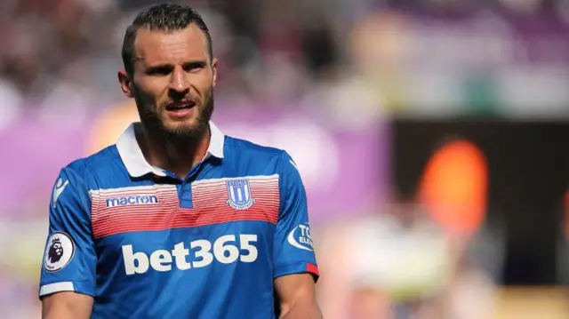 Erik Pieters in action for Stoke City in his playing days. He is wearing a blue club away shirt