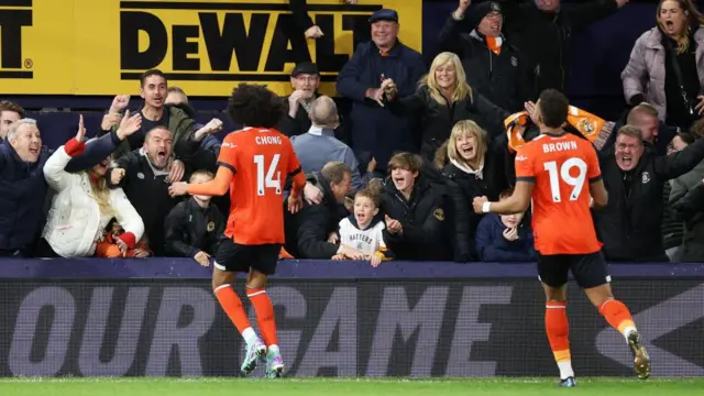 Chong celebrates his goal