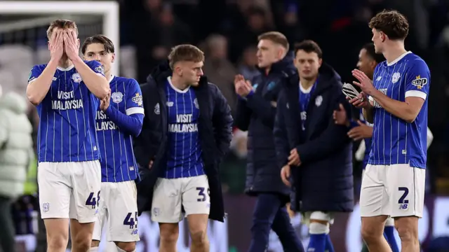 Dylan Lawlor (left) and Cardiff's players look disappointed after losing to Chelsea