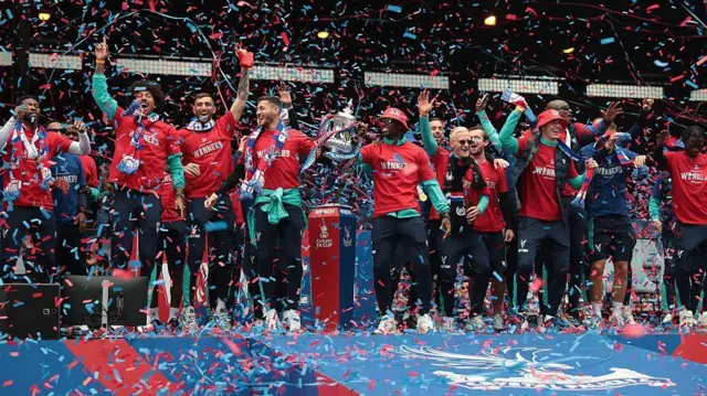 Crystal Palace players celebrate FA Cup trophy at Selhurst Park
