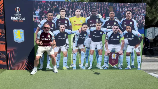 Aston Villa fan Jamie with the Aston Villa squad photo 