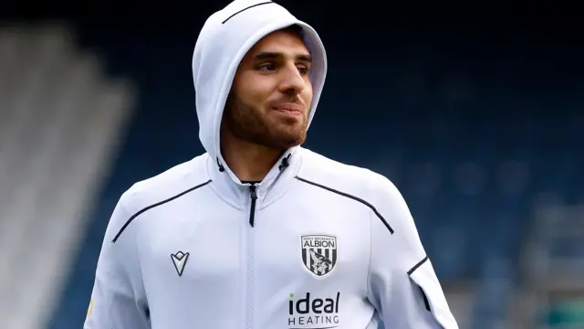 Tammer Bany wearing a West Brom hooded top