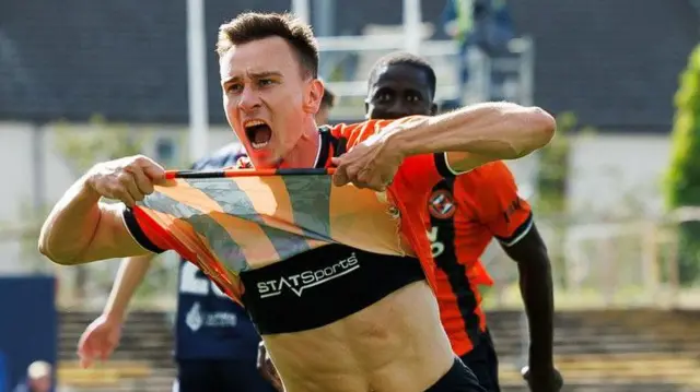 Ivan Dolcek celebrates his derby goal at Dens Park