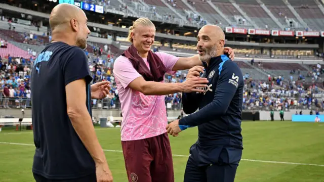 Enzo Maresca talks to Pep Guardiola and Erling Haaland