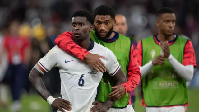 Joe Gomez puts his arm around England teammate Marc Guehi after Euro 2024 final defeat to Spain