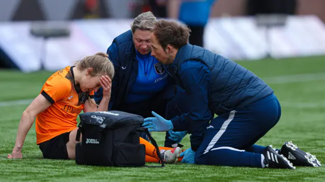 Glasgow City's Fiona Brown receives on-pitch treatment during a Scottish Women's Premier League match between Rangers and Glasgow City 