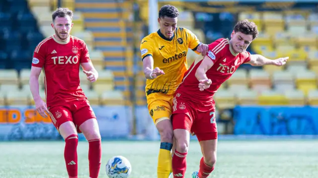 Dante Polvara battles for possession against Livingston