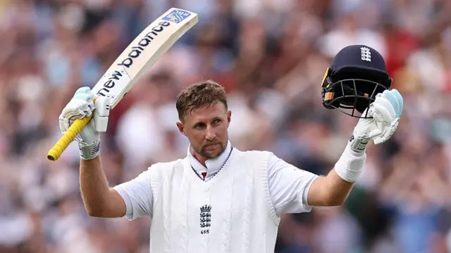 Joe Root celebrates a century during England's Test series against India in August