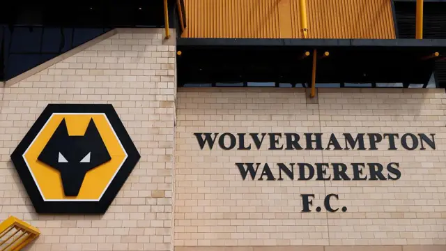 Wolves' club badge and "Wolverhampton Wanderers FC" on an outside wall of Molineux stadium