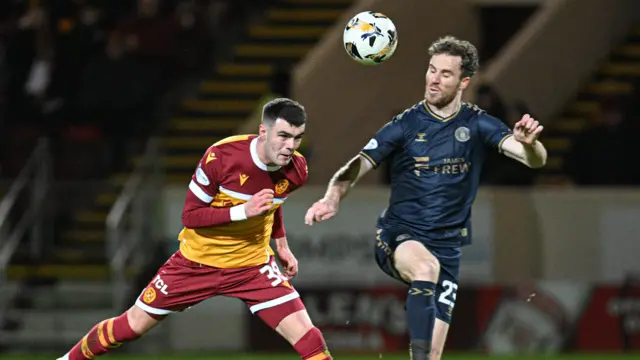 Motherwell's Lennon Miller and Kilmarnock's Marley Watkins challenge for the ball