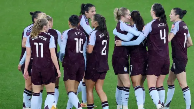 Aston Villa players celebrate after late goal against Crystal Palace