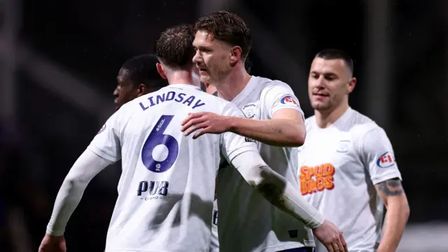 Preston players embrace following their victory over Sheffield United