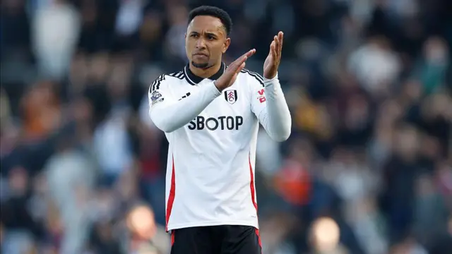 Kenny Tete of Fulham applauds the fans