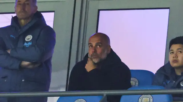 Pep Guardiola watches from stand