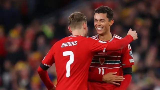 Brennan Johnson smiles and celebrates with David Brooks