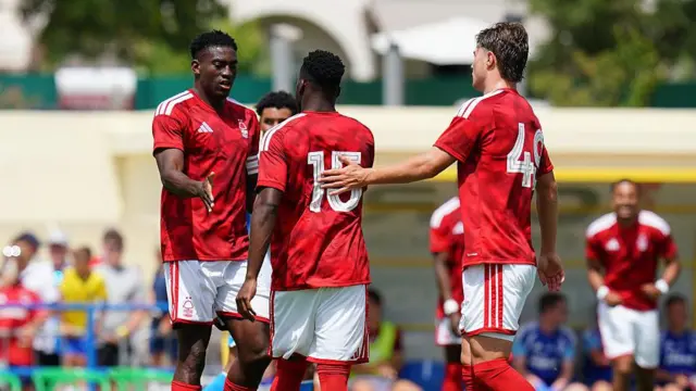Arnaud Kalimuendo of Nottingham Forest celebrates with Taiwo Awoniyi