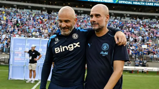 Enzo Maresca talks to Pep Guardiola after the Pre-Season Friendly match