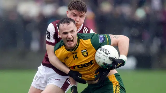 Donegal's Jason McGee is challenged by Galway's Liam O'Conghaile