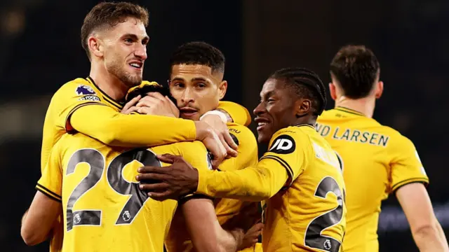 Wolves players celebrate a goal against Crystal Palace