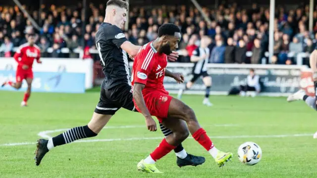 Aberdeen's Shayden Morris (right) against Elgin City