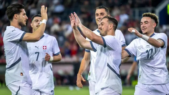 Xherdan Shaqiri, second right, scored Switzerland's fourth