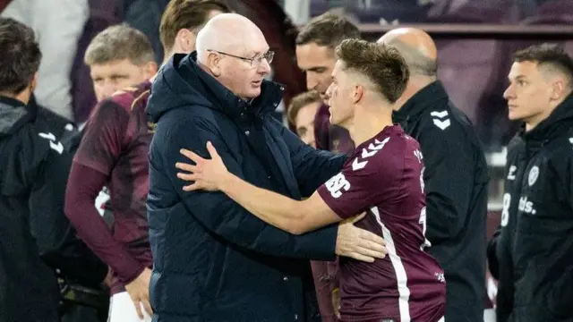 Falkirk's John McGlynn shakes hands with Hearts' Cammy Devlin
