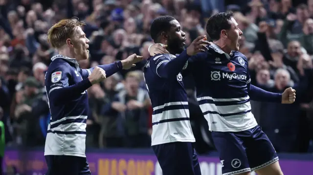 Millwall players celebrate after Japhet Tanganga scores