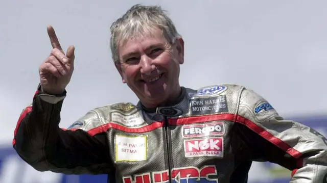 Joey Dunlop celebrates one of his 26 Isle of Man TT wins