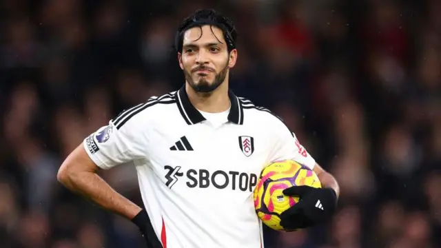 Raul Jimenez holding a football