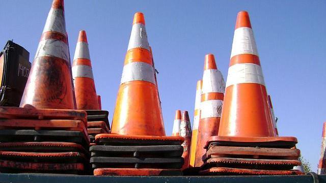 Eight piles of orange traffic cones 