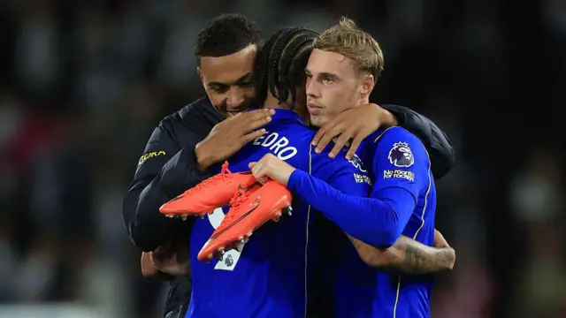 Joao Pedro, Morgan Rogers and Cole Palmer of Chelsea celebrate
