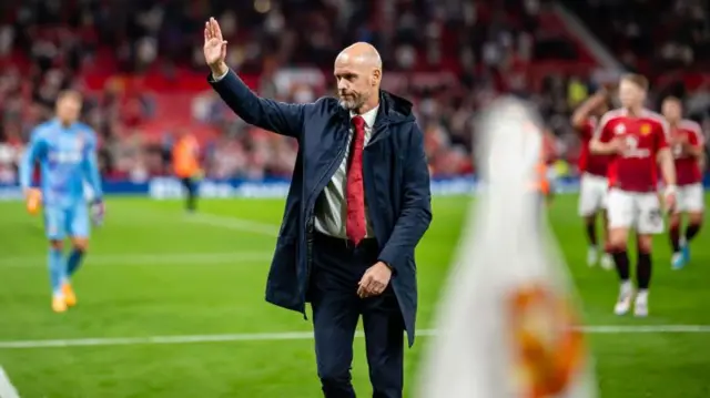 Erik ten Hag waves to the crowd after Manchester United's win over Fulham