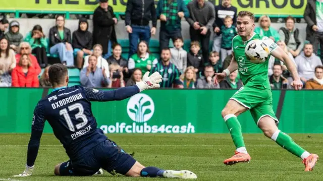 Aston Oxborough saves Chris Cadden's shot