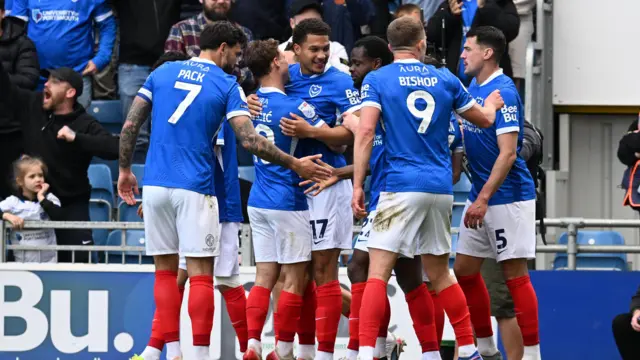 Portsmouth players celebrate after scoring during the win over Leicester.