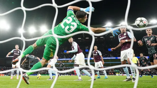 Emi Martinez makes a save for Aston Villa against Bayern Munich